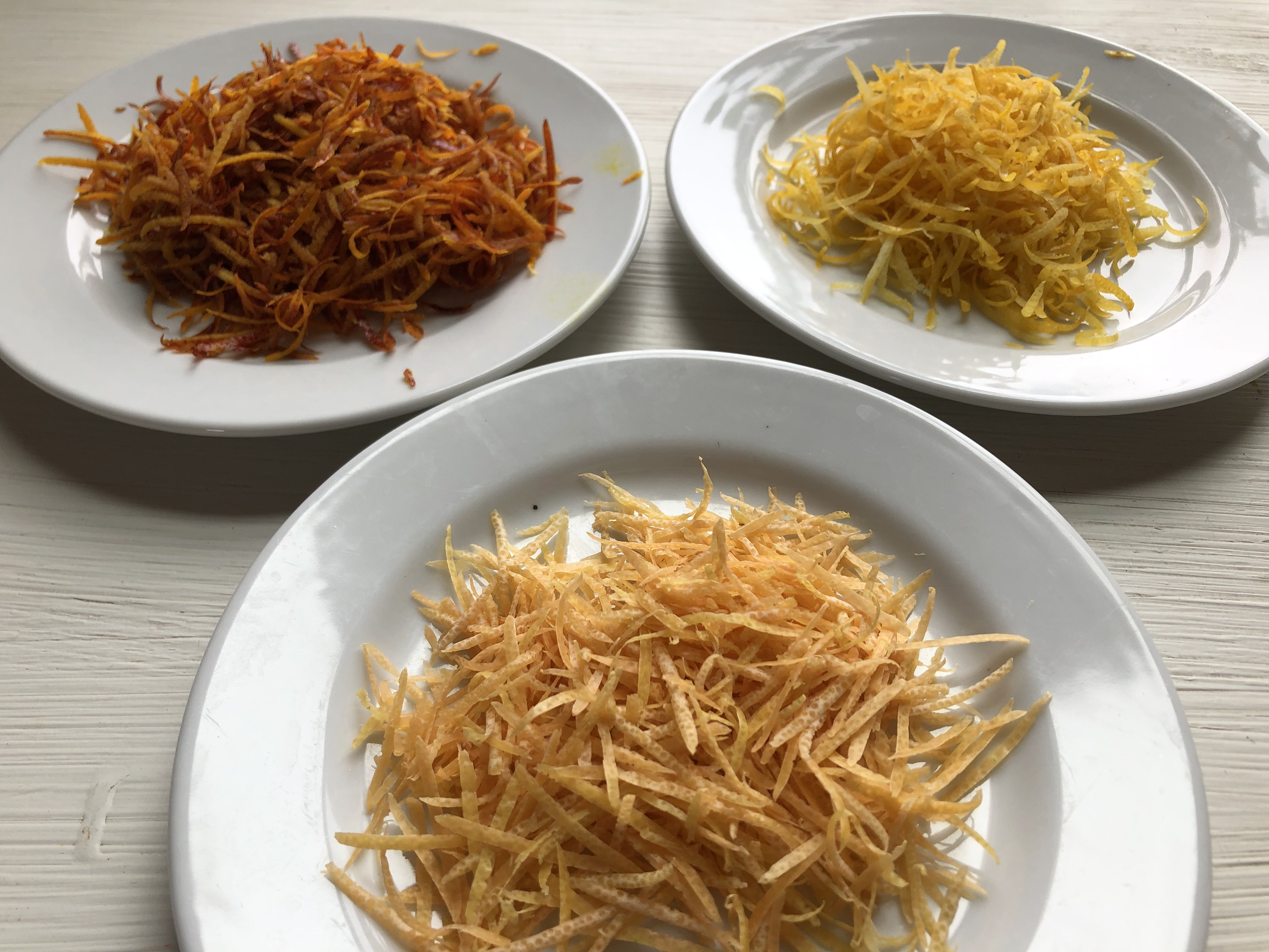 Shredded roots sorted by variety on white plates